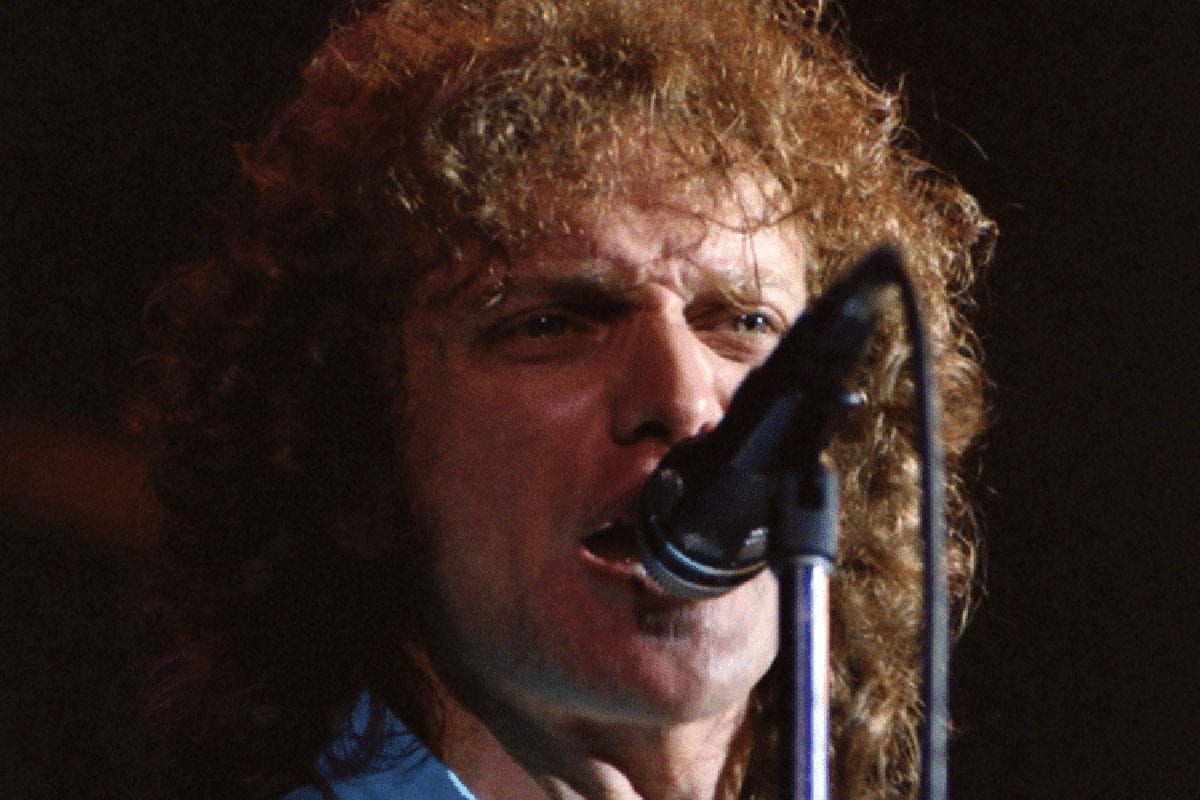 Lou Gramm mid-performance with the crowd in the background